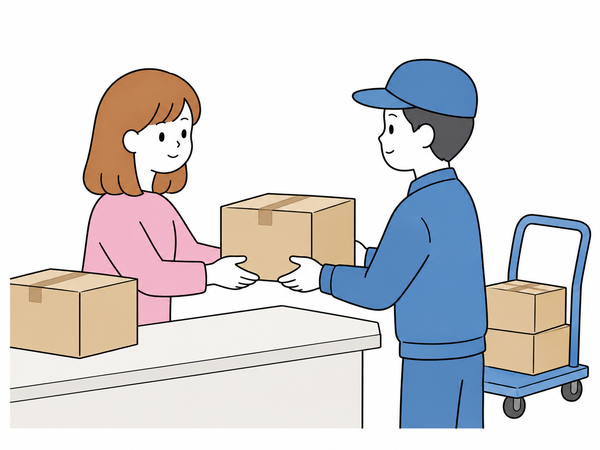 自社の出荷場で、梱包済みの箱をスタッフが宅配業者へ引き渡す
